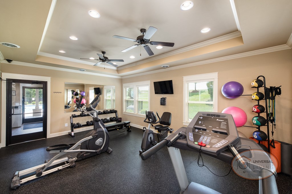 A fitness center with weight training and cardio equipment.