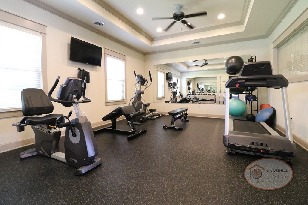 A fitness center with weight training and cardio equipment.