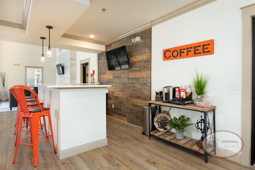A coffee bar with a flat screen TV.