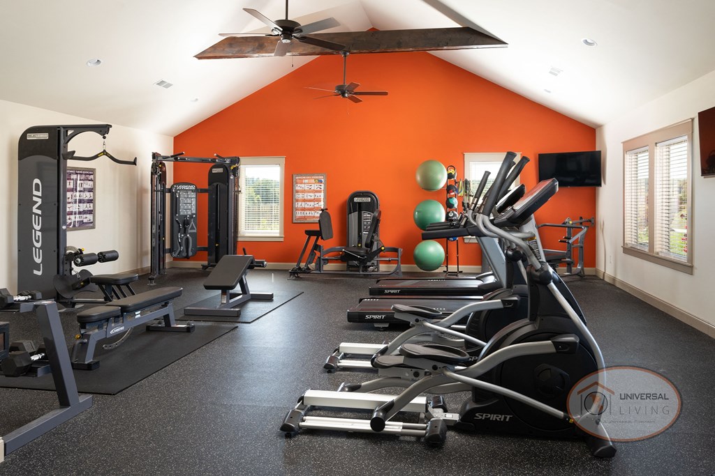A fitness center with weight training and cardio equipment.