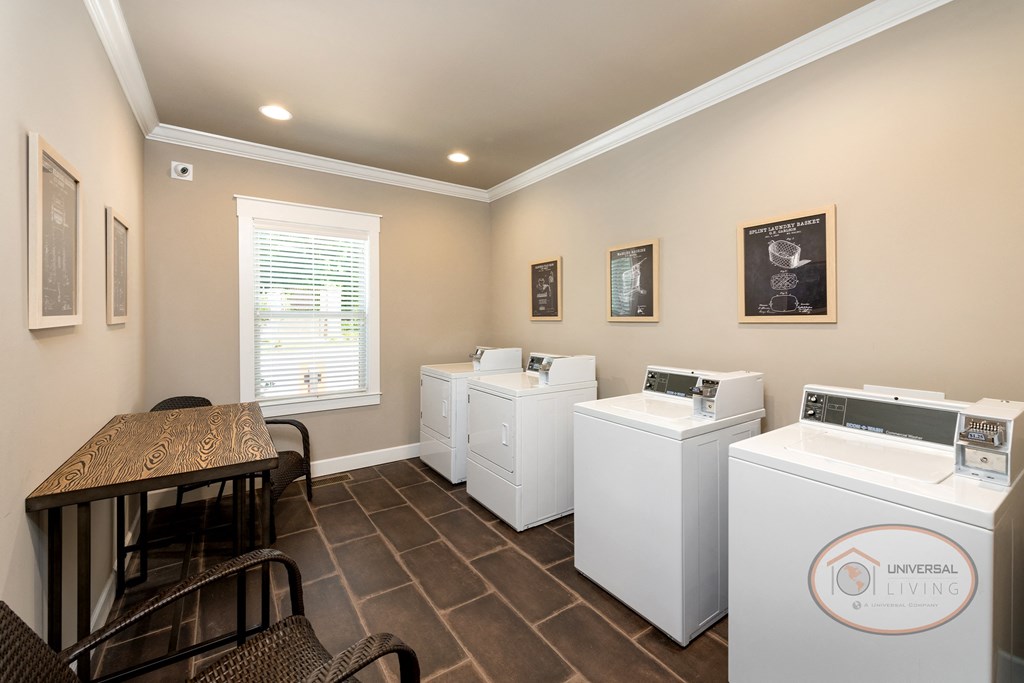 A laundry center with tables and seating..