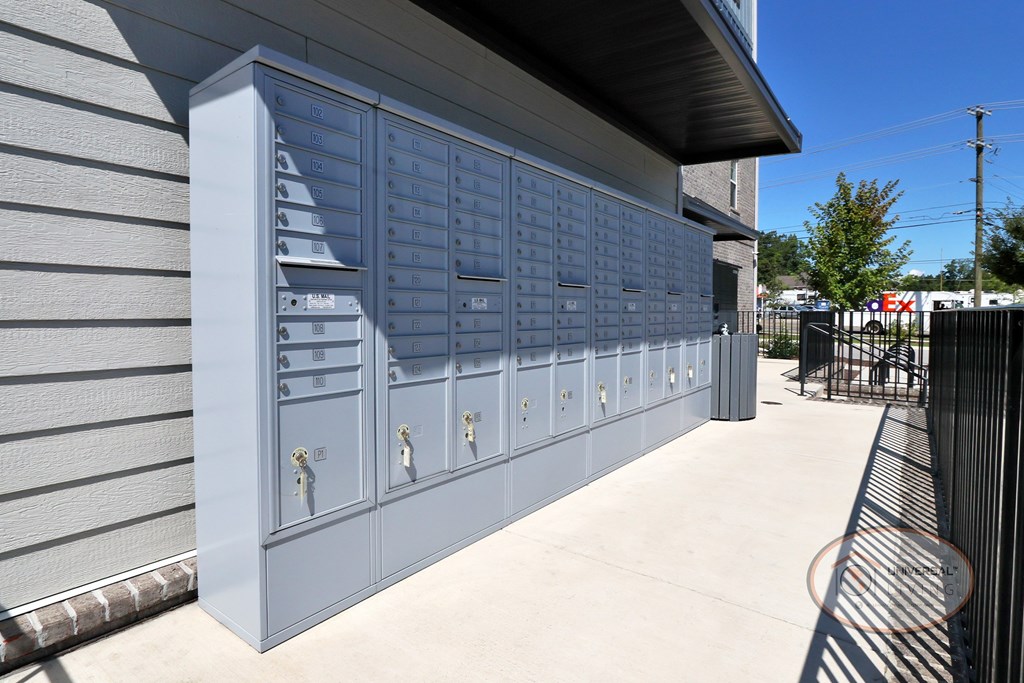 A row of mailboxes outside of the apartment compelx.