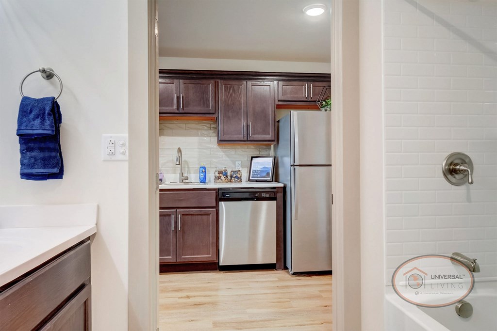 A view of the kitchen from inside the bathroom.