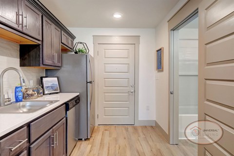 A kitchen with wooden cabinets and a white countertop.
