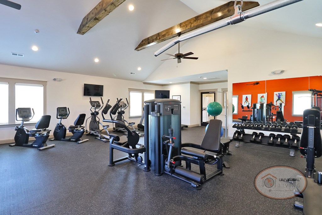 A fitness center with weight training and cardio equipment.