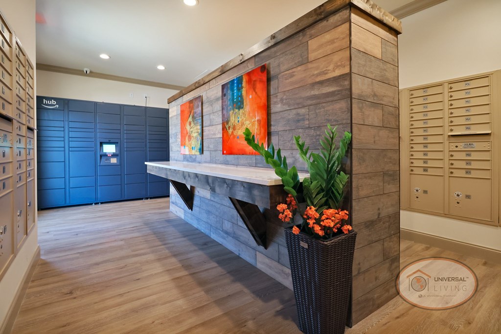 The mail room with table and amazon delivery hub.