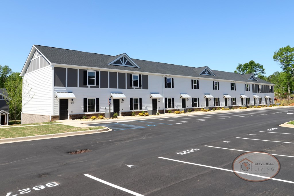 A white and gray apartment building .