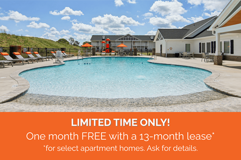 A pool surrounded by sun loungers and umbrellas with a sign offering a free month with a 13-month lease for select apartment homes.