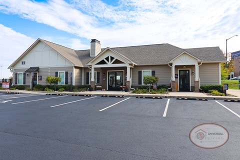 A building with a parking lot in front of it.