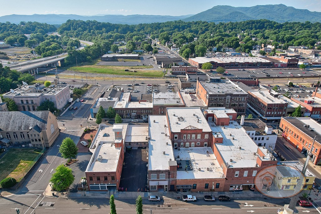 A view of the city from the air with mountains in the background.