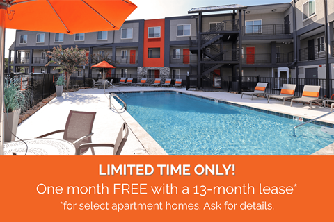 A pool surrounded by chairs and umbrellas with a sign offering a free month with a 13-month lease.