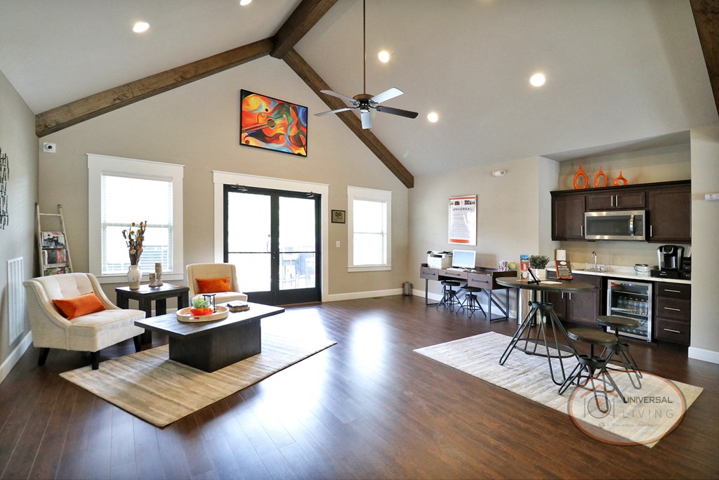 The clubhouse lounge, complete with fireplace, flat screen TV, and ceiling fans.
