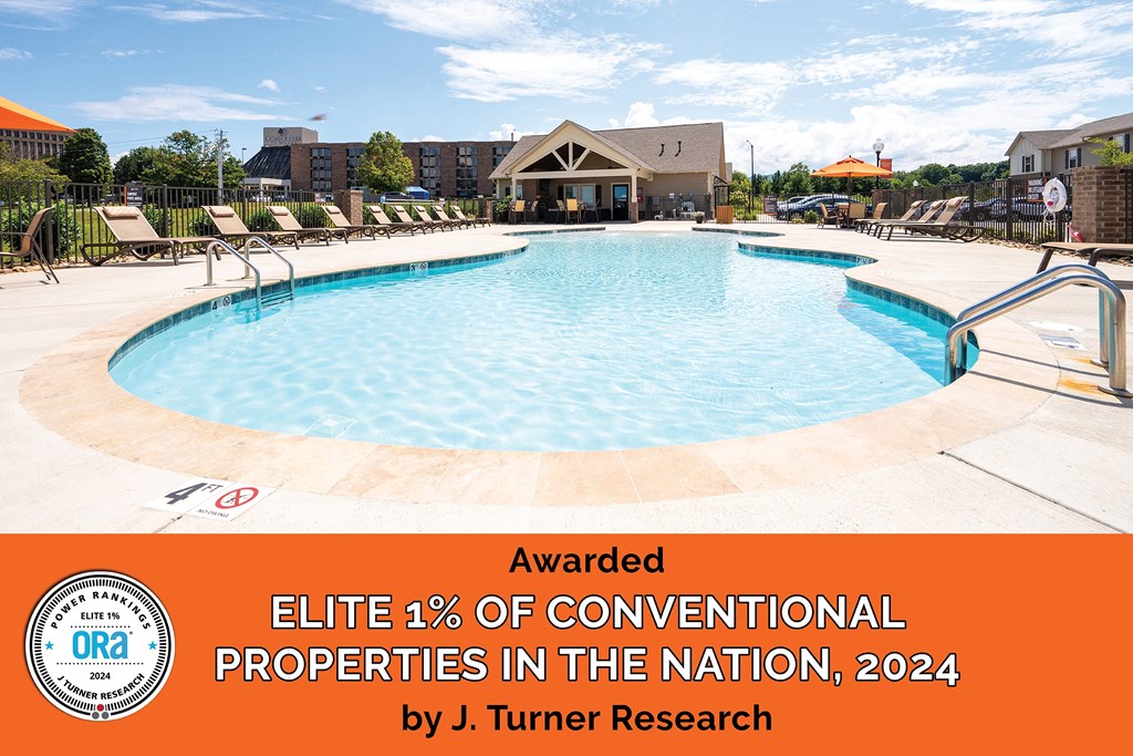 A swimming pool with a banner that reads Awarded Elite 1% of Conventional Properties in the Nation, 2024 by J. Turner Research.