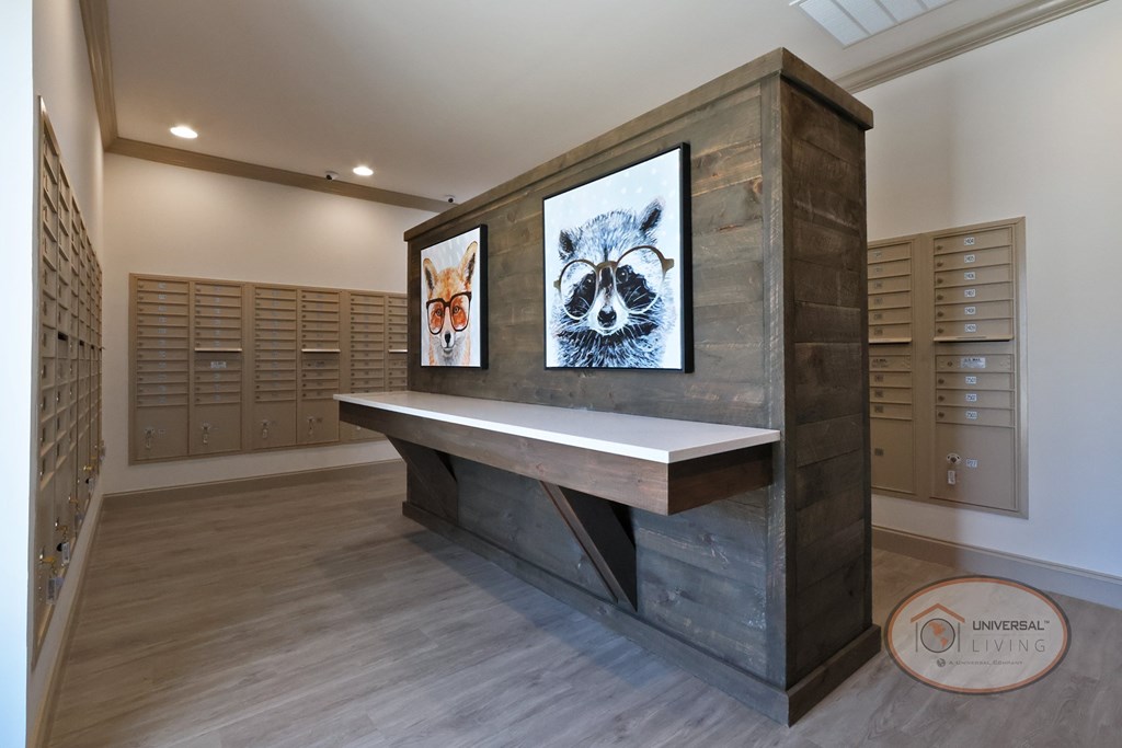 The mail center with mail boxes, Amazon package Hub, and table.