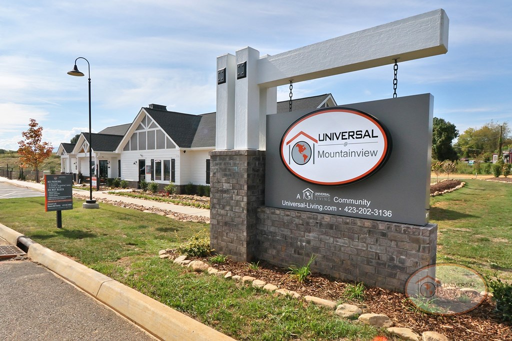 The property sign for Universal at Mountainview with clubhouse in the background.