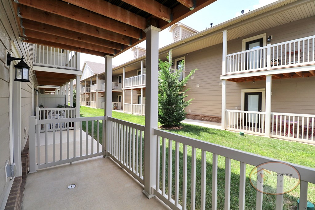A view from a fenced in, covered patio.