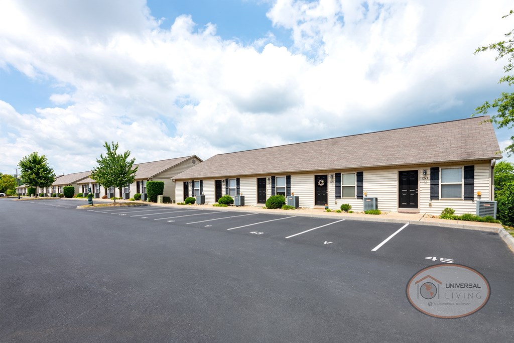 an empty parking lot in front of an office building