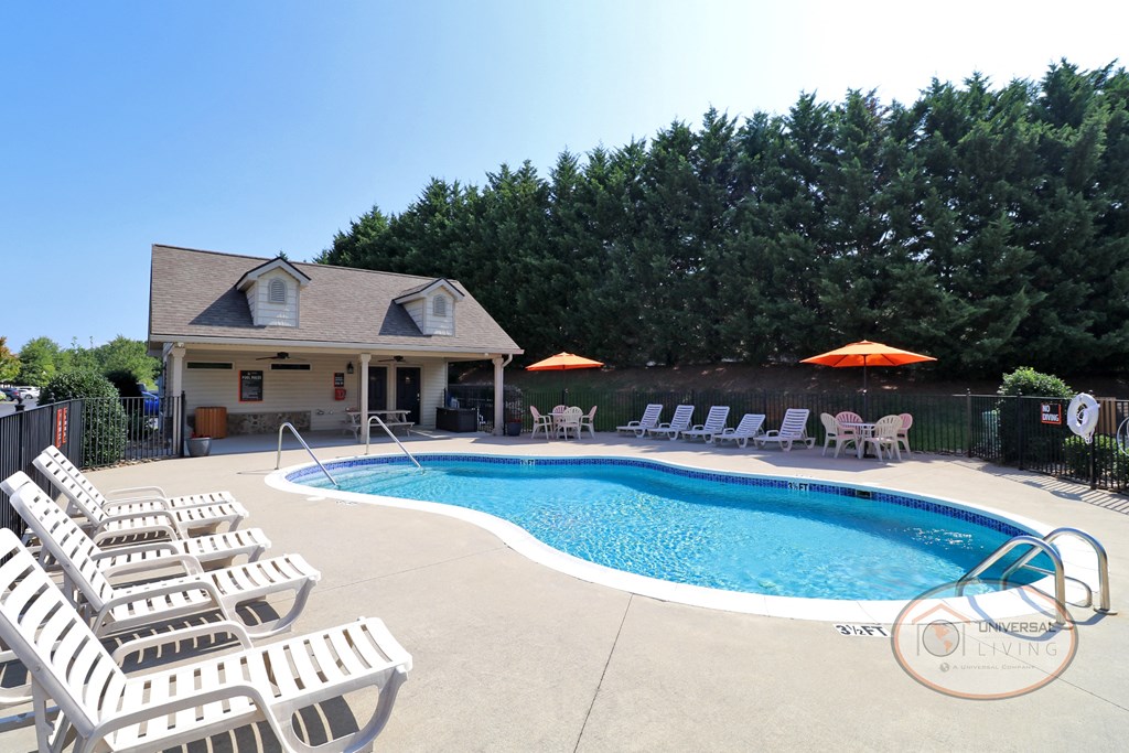 the pool is in front of the pool house
