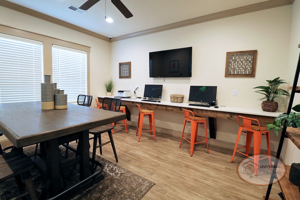 The business center with free Wi-Fi, flat screen TV, and computers.