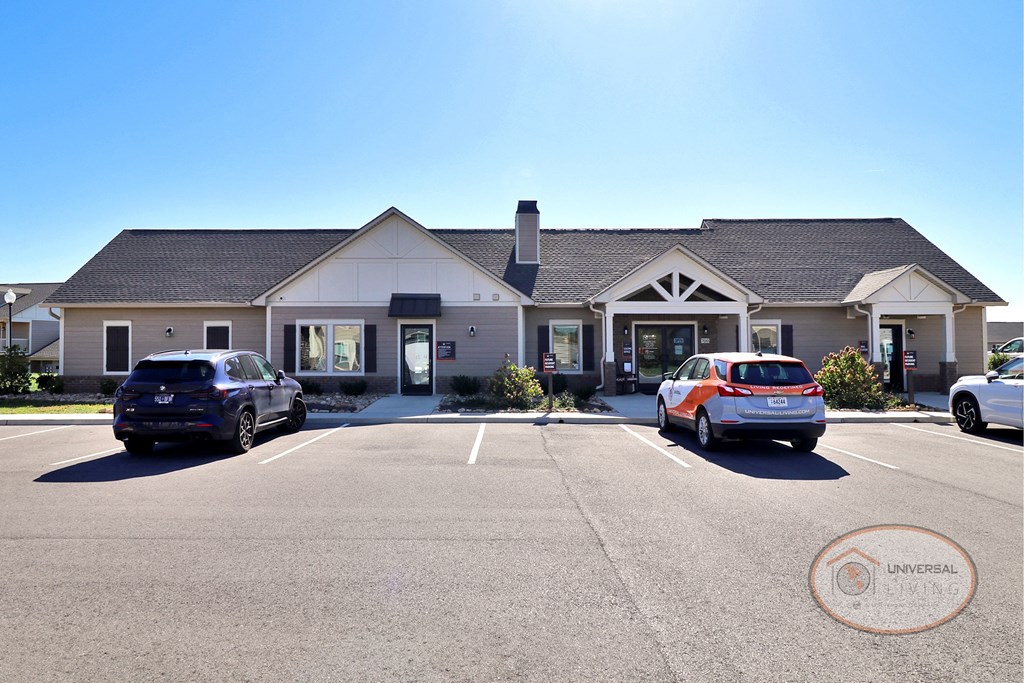 The clubhouse and leasing office with parking.