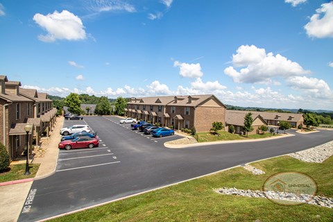 A wide view of the property and apartment buildings.