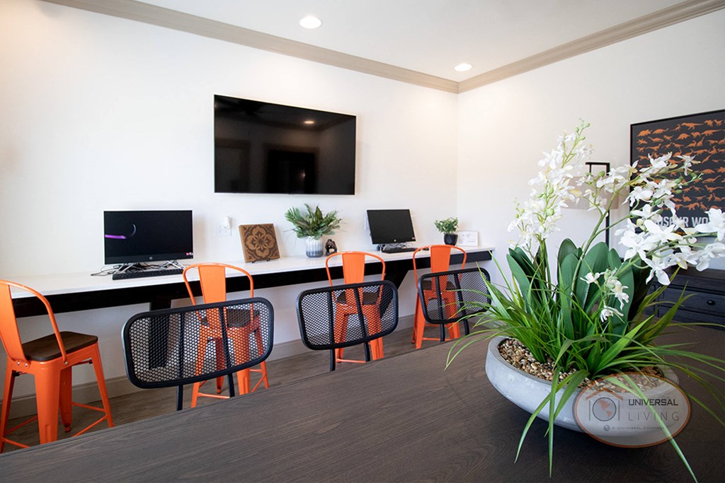The clubhouse business center with free WI-FI, flat screen TV, computers, printers, and lounge seating.