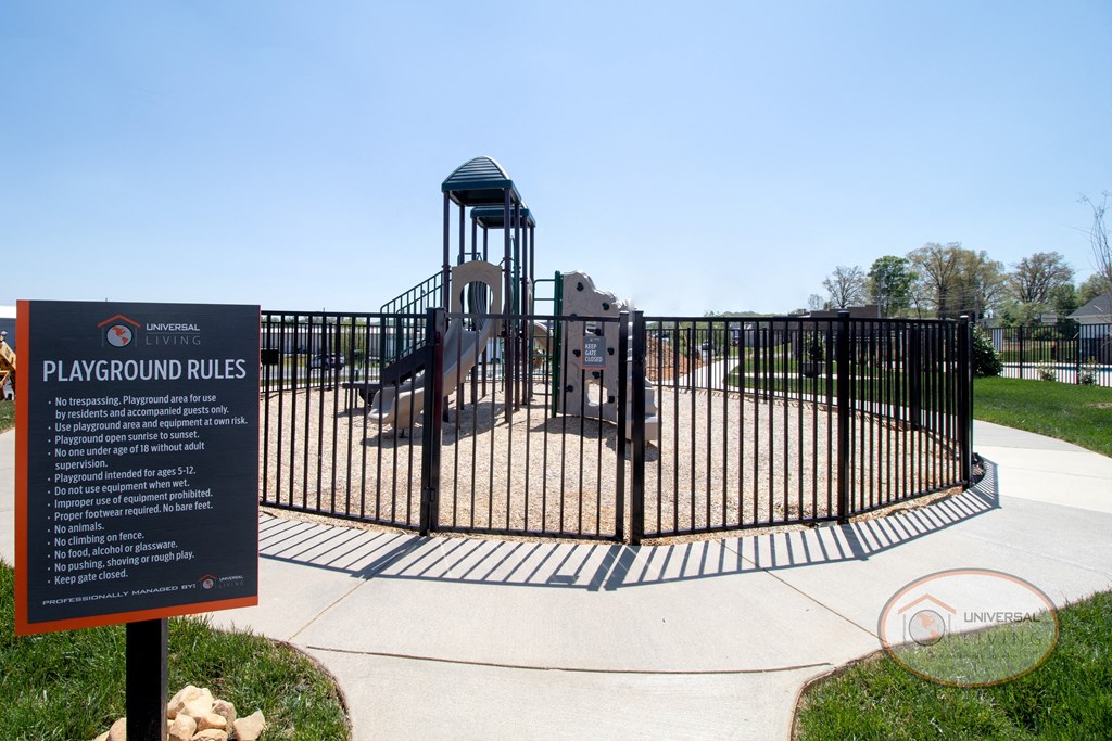 A soft topped playground with slide and jungle gym.