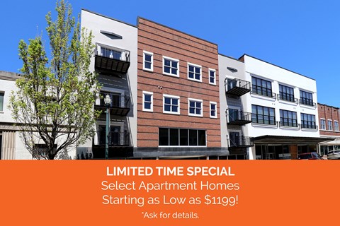 Apartment complex with a sign offering apartments for $119.