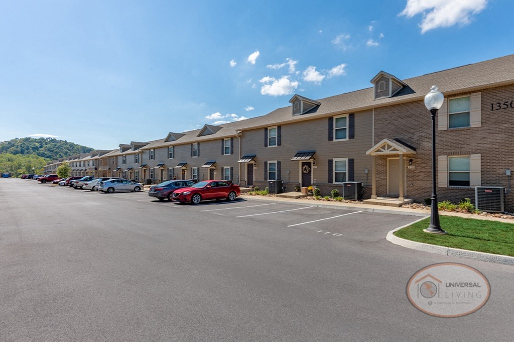 Front of tan apartment building.