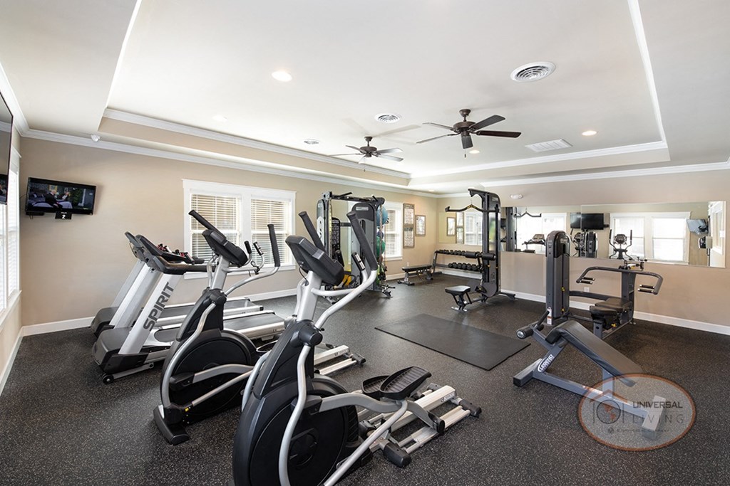 A fitness center with weight training and cardio equipment.