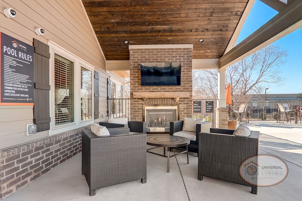 the retreat at thousand oaks clubhouse patio with fireplace and seating