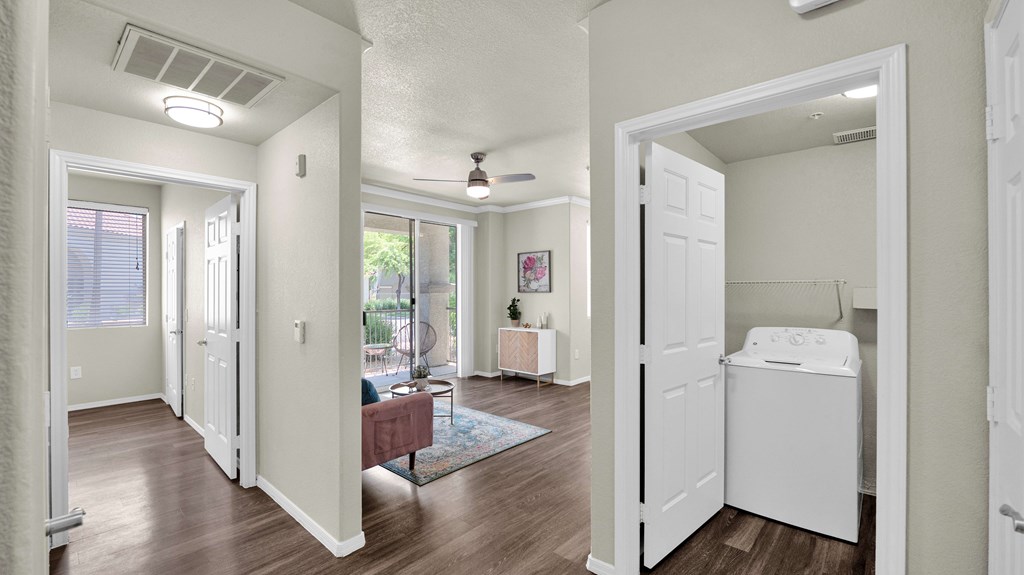 A white laundry room with a washer and dryer.