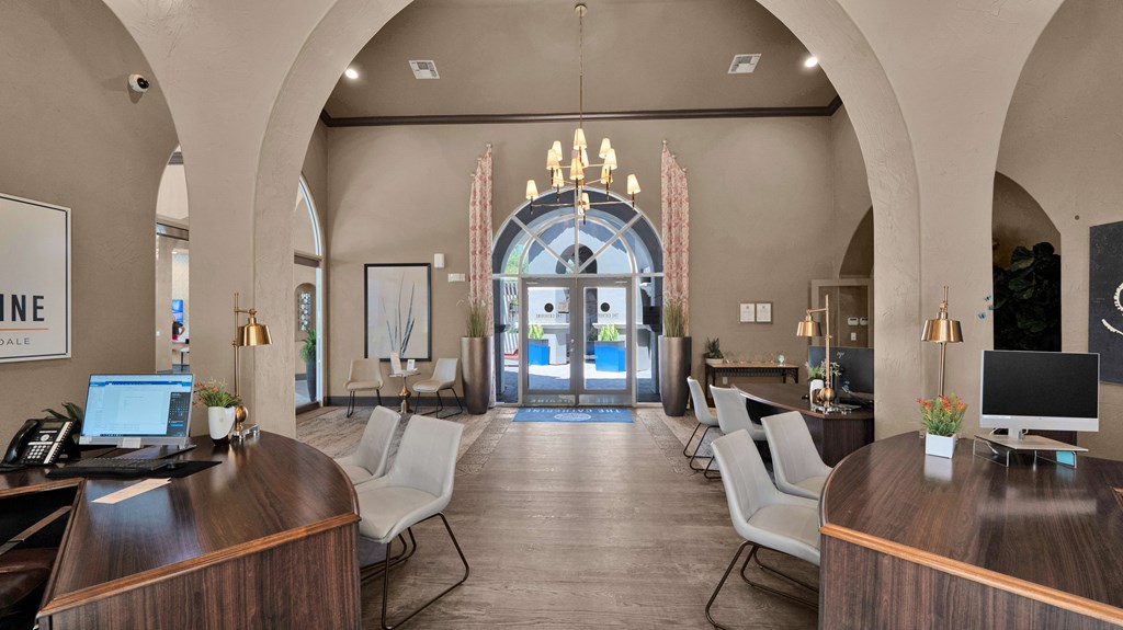 A reception area with a desk and chairs.