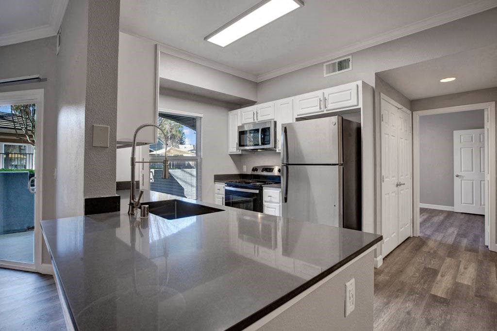 A modern kitchen with a large island in the center.