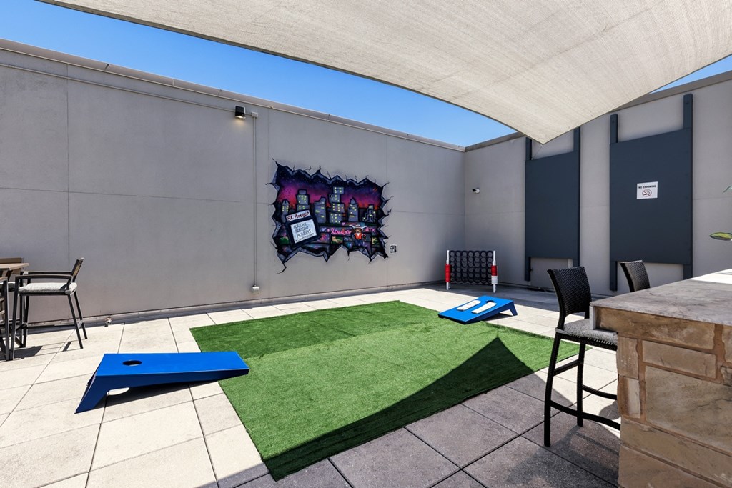 A room with a blue mat on the floor and a chair.