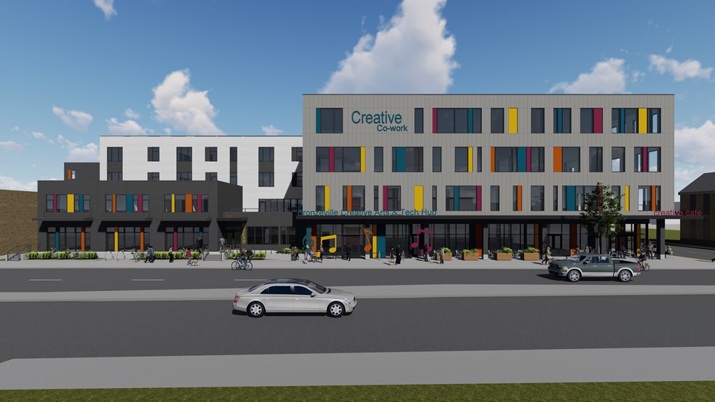 A rendering of a modern building with the words "Creative Cowork" on the side.