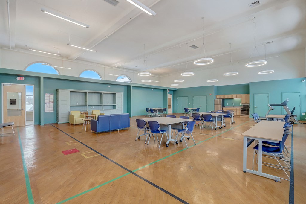 a large room filled with tables and chairs and tables