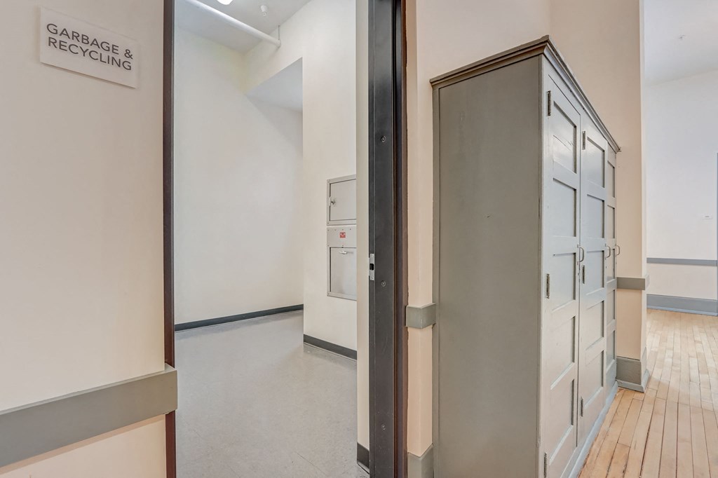 a view of a room with a filing cabinet in the middle of it
