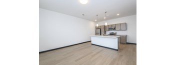 A reception area with a white counter and a microwave above it.