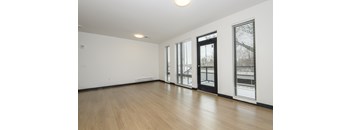 A room with wooden floors and white walls.