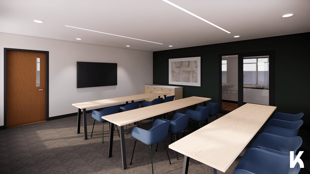 A conference room with a long table, chairs, and a television.