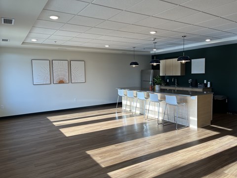 A reception area with a counter and chairs.