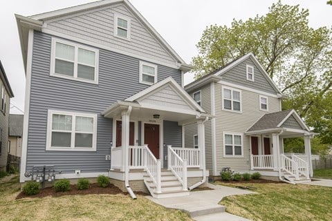 A two-story house with a front porch.