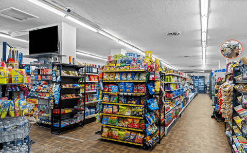 A store aisle filled with a variety of snack foods.