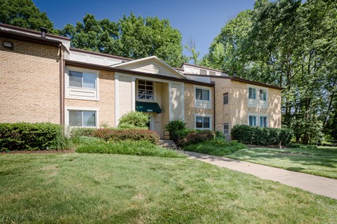 A building with a green lawn in front at Potomac Ridge Apartments, Woodbridge, VA