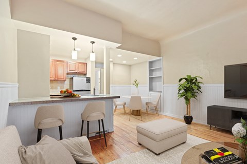 a living room with a kitchen and an open floor plan