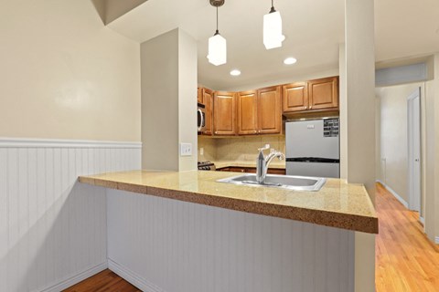 a kitchen with a counter top and a sink