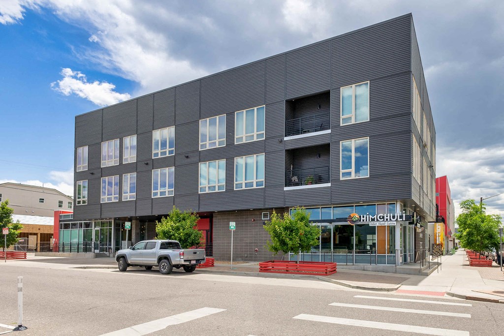 a building with a truck parked in front of it on a street