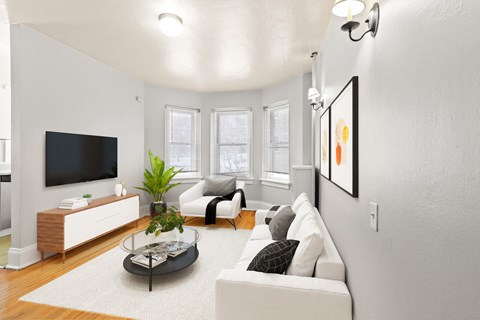 a living room with a couch and a tv