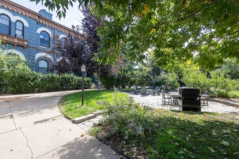 a park with a picnic table in front of a building